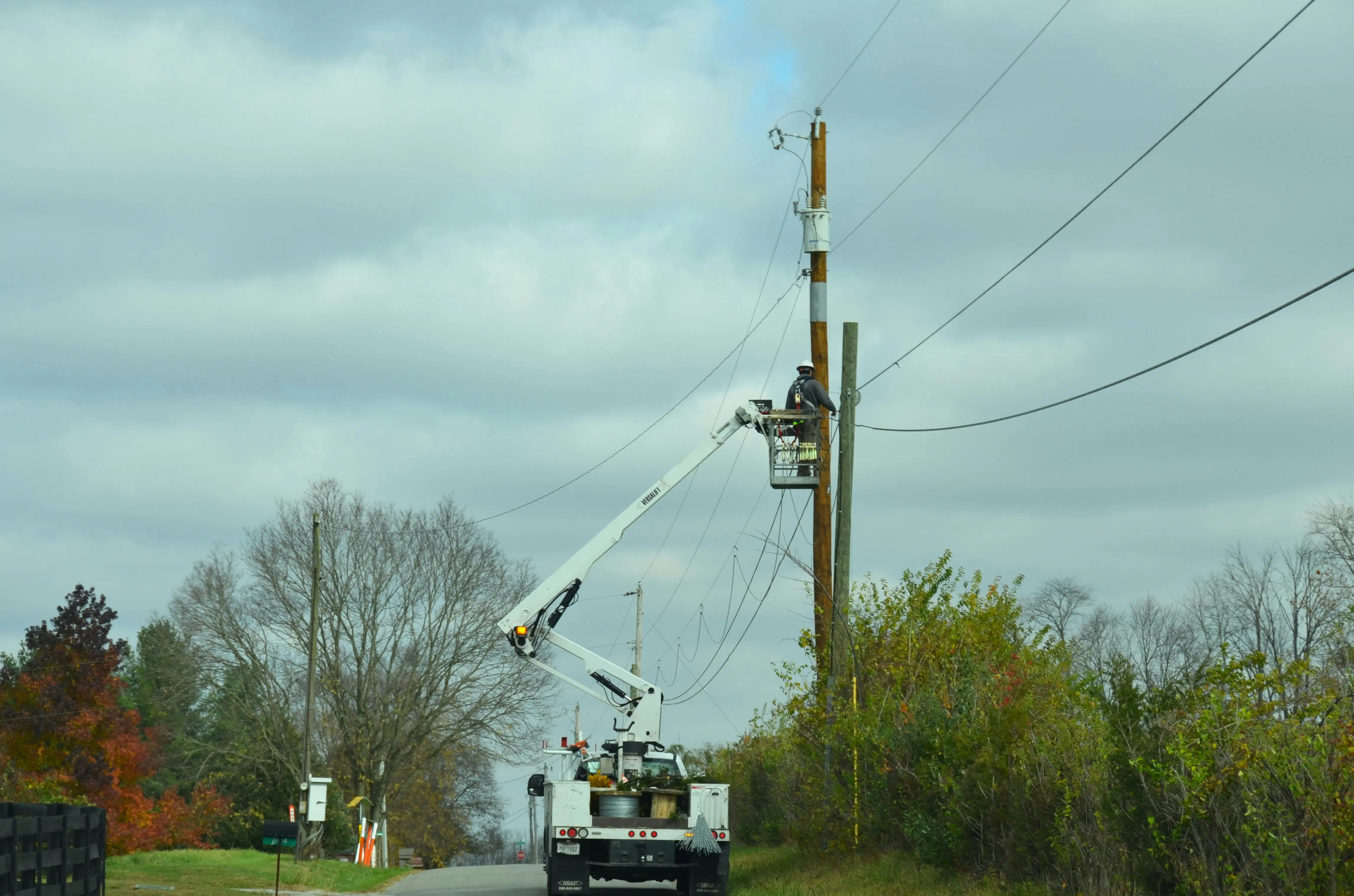 Open electrical control box mounted on a utility pole outdoors